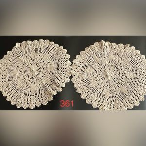 Set of two hand crocheted dollies.